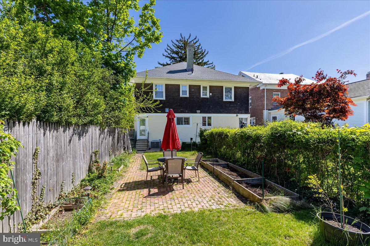 28 Jefferson Road Princeton, NJ 08540 - Photo 25 of 25 a front view of a house with a yard glass top table and chairs