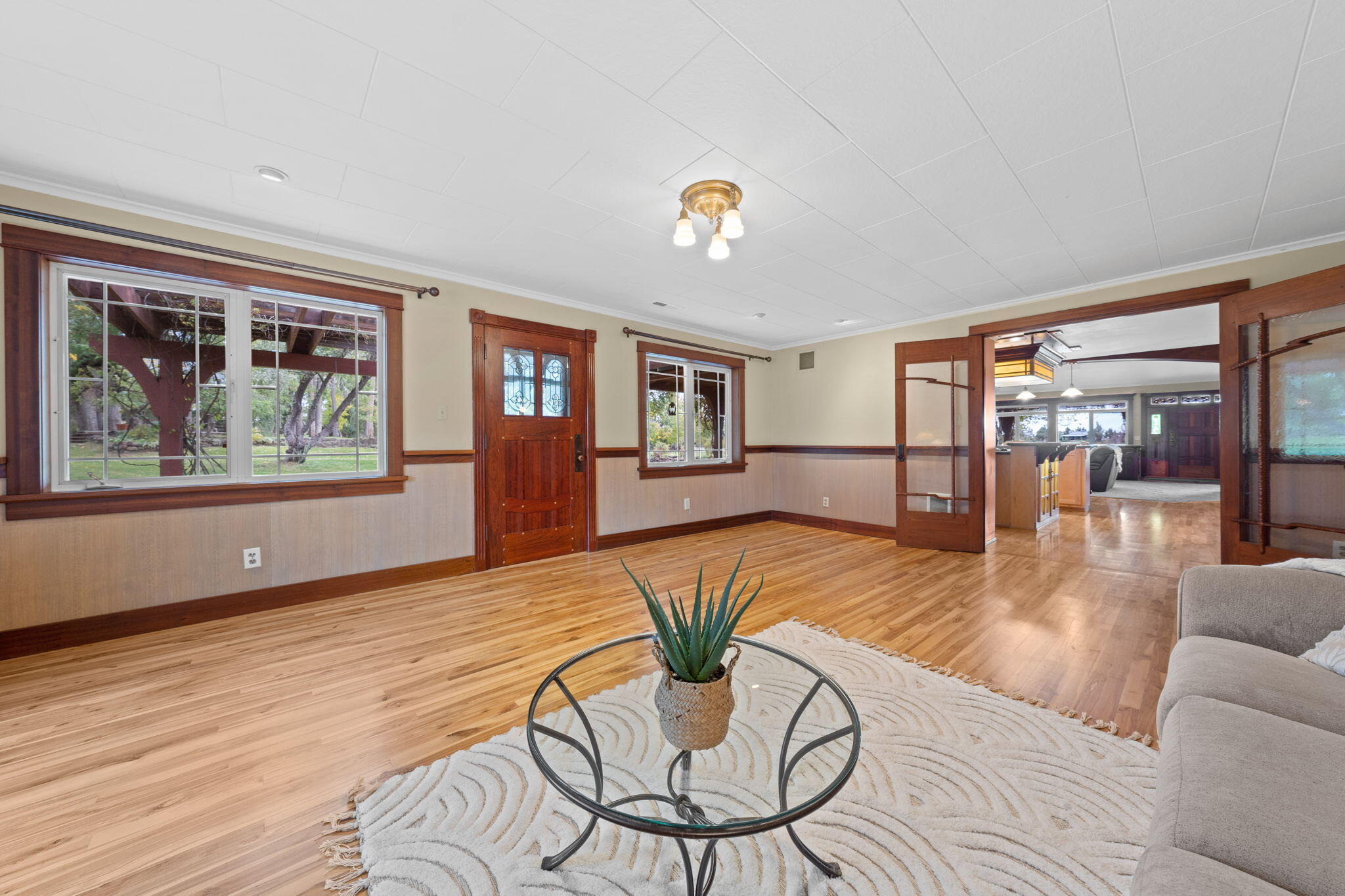 21925 Bear Creek Road Bend, OR 97702 - Photo 32 of 104 a living room with furniture and a large window