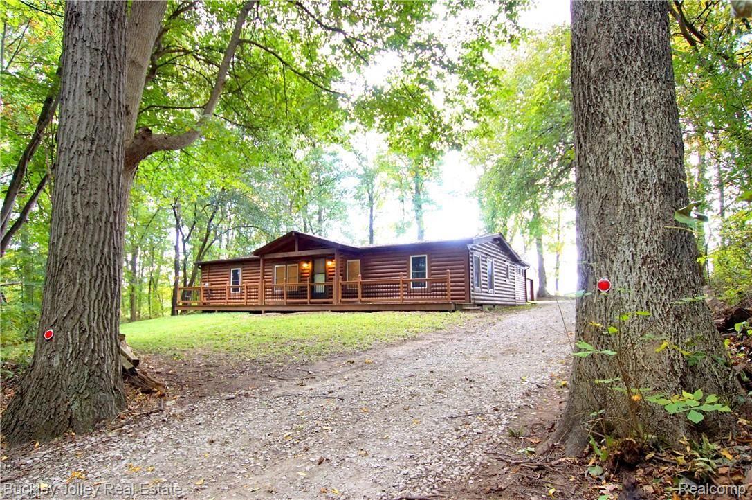 10878 Tuthill Road South Lyon, MI 48178 - Photo 1 of 21 Log Faced Ranch.JPG