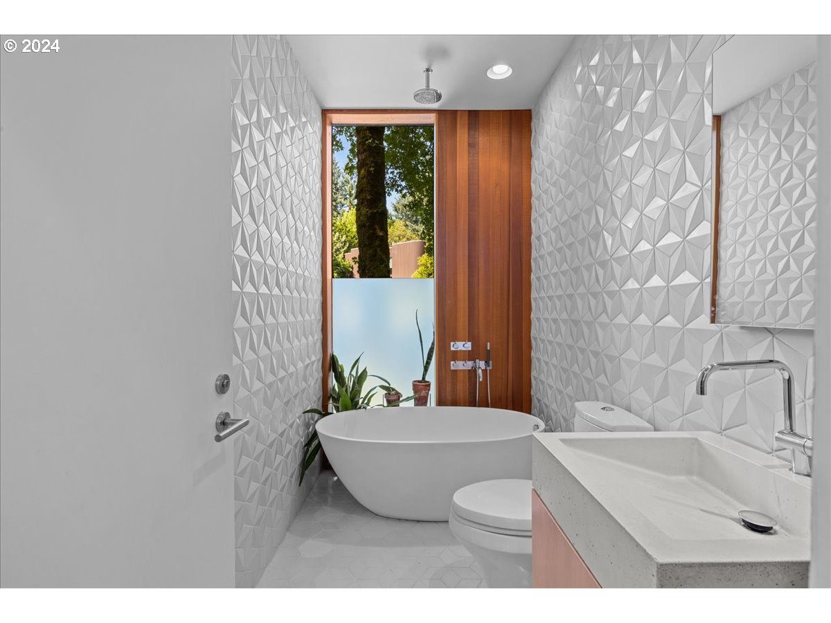 3204 Southwest Upper Cascade Drive Portland, OR 97205 - Photo 17 of 40 a bathroom with a sink toilet and shower