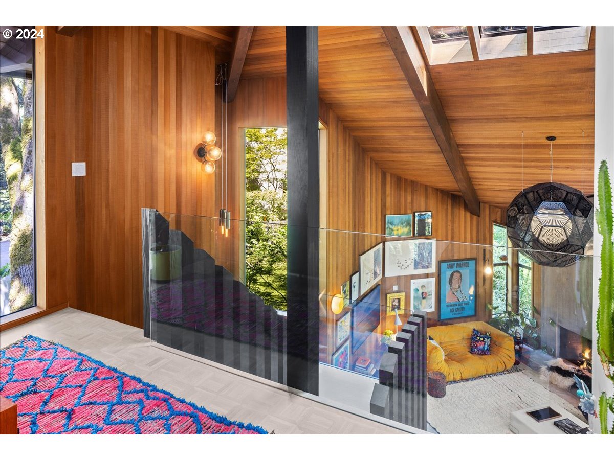 3204 Southwest Upper Cascade Drive Portland, OR 97205 - Photo 19 of 40 a picture of a bench in front of a building