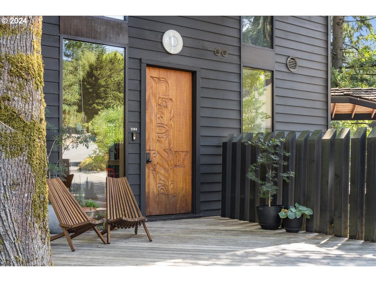 3204 Southwest Upper Cascade Drive Portland, OR 97205 - Photo 2 of 40 a view of a house with backyard and sitting area