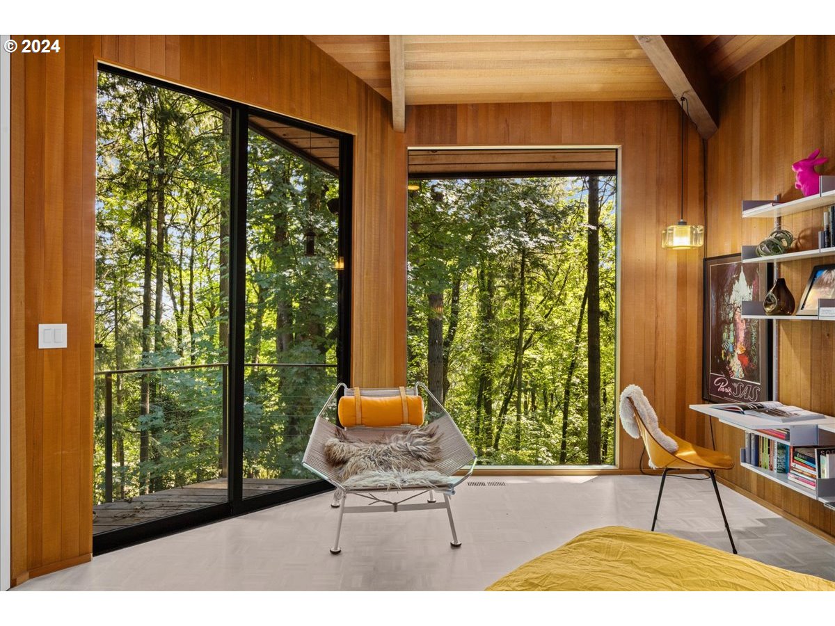 3204 Southwest Upper Cascade Drive Portland, OR 97205 - Photo 21 of 40 a view of a living room and floor to ceiling window and an entryway