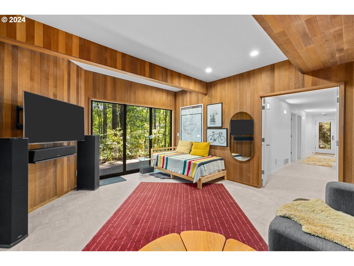 3204 Southwest Upper Cascade Drive Portland, OR 97205 - Photo 29 of 40 a living room with furniture and a flat screen tv