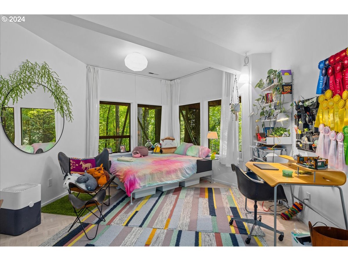 3204 Southwest Upper Cascade Drive Portland, OR 97205 - Photo 30 of 40 a living room filled with furniture and a floor to ceiling window