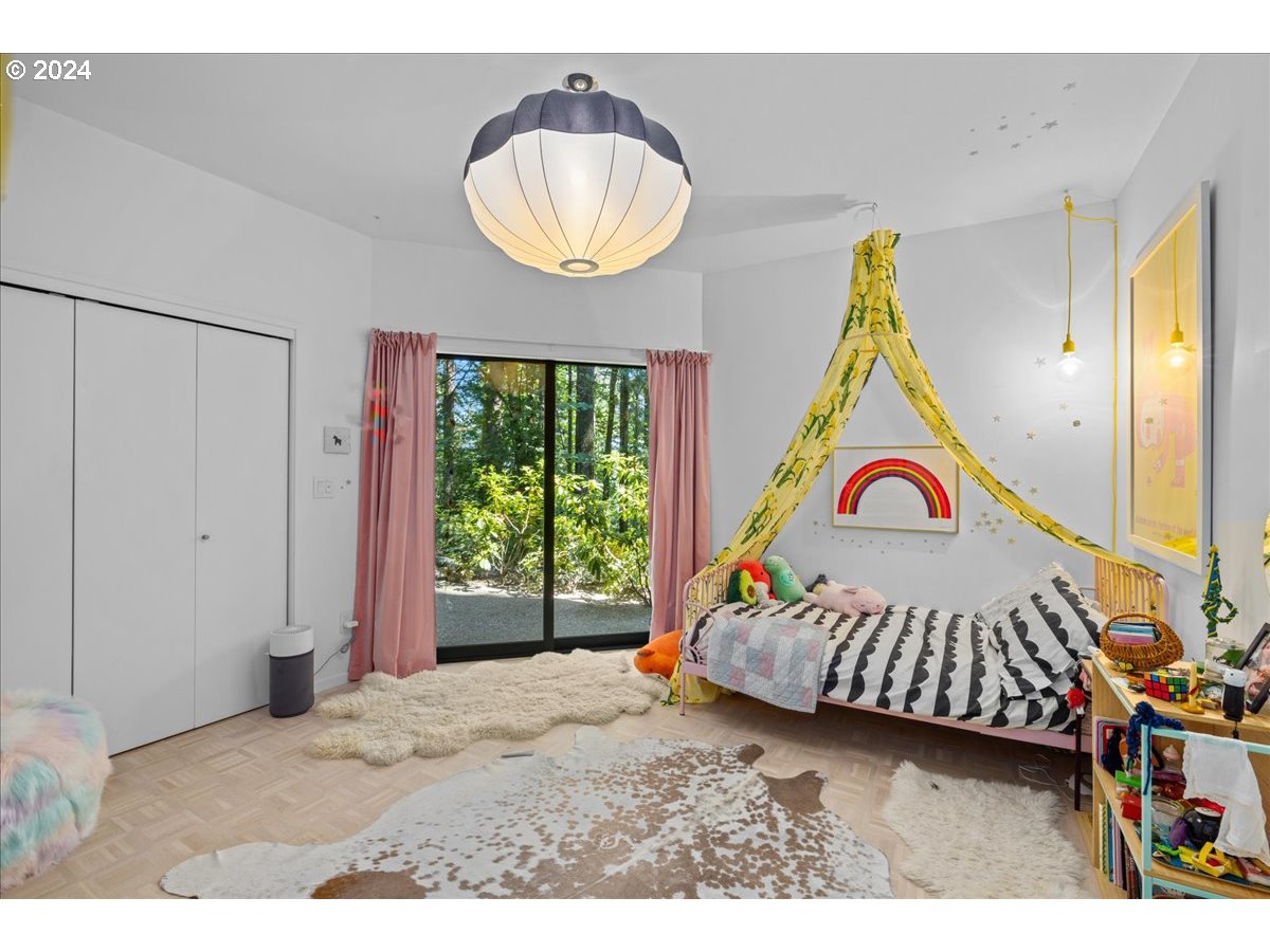 3204 Southwest Upper Cascade Drive Portland, OR 97205 - Photo 32 of 40 a bedroom with a bed and a window