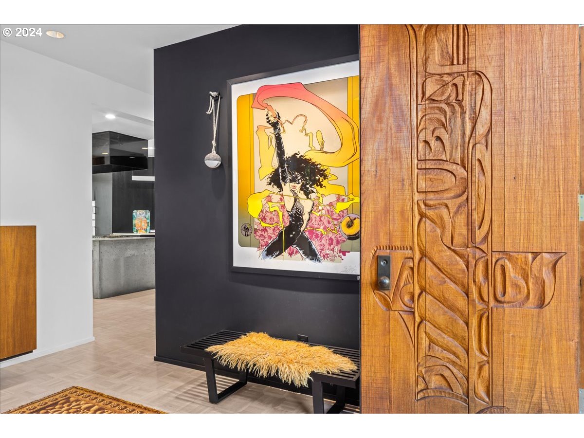 3204 Southwest Upper Cascade Drive Portland, OR 97205 - Photo 33 of 40 a bedroom with a bed and painting on the wall