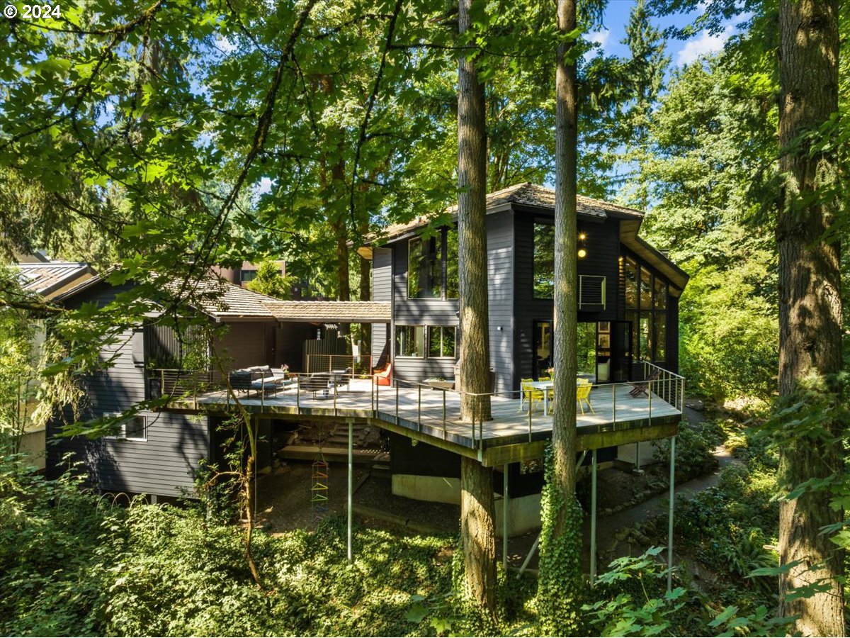 3204 Southwest Upper Cascade Drive Portland, OR 97205 - Photo 38 of 40 a view of house with outdoor seating and covered with trees