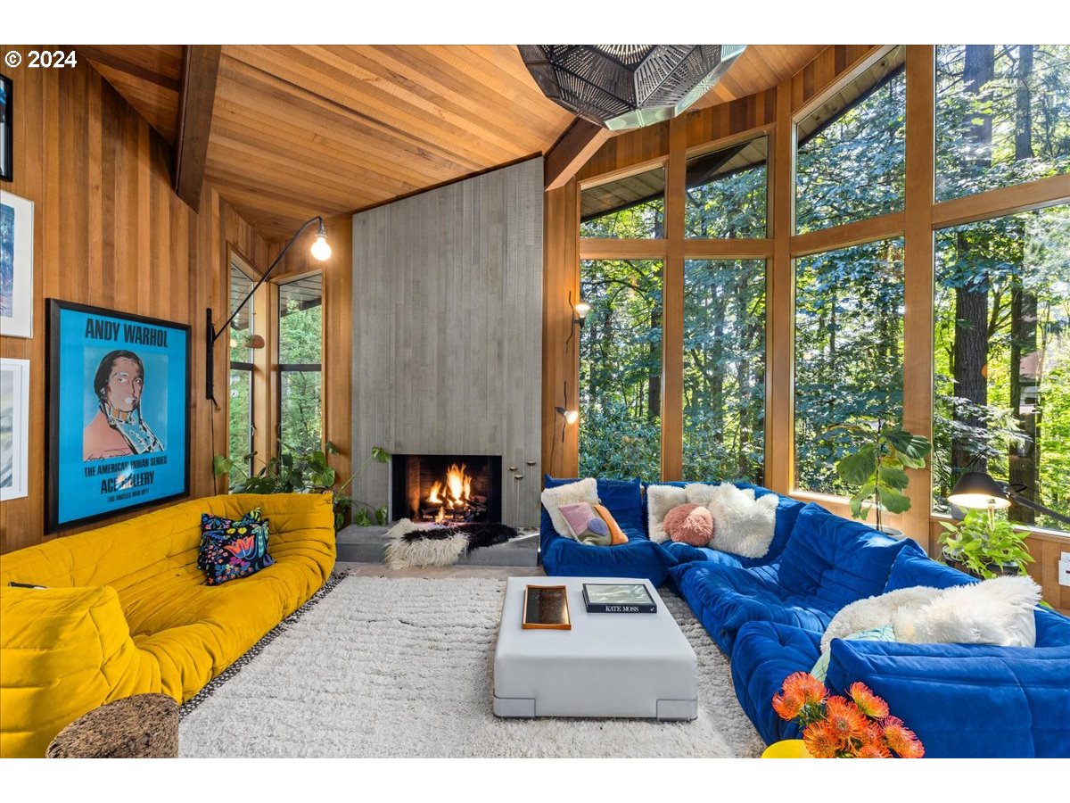 3204 Southwest Upper Cascade Drive Portland, OR 97205 - Photo 4 of 40 a living room with furniture fireplace and a large window