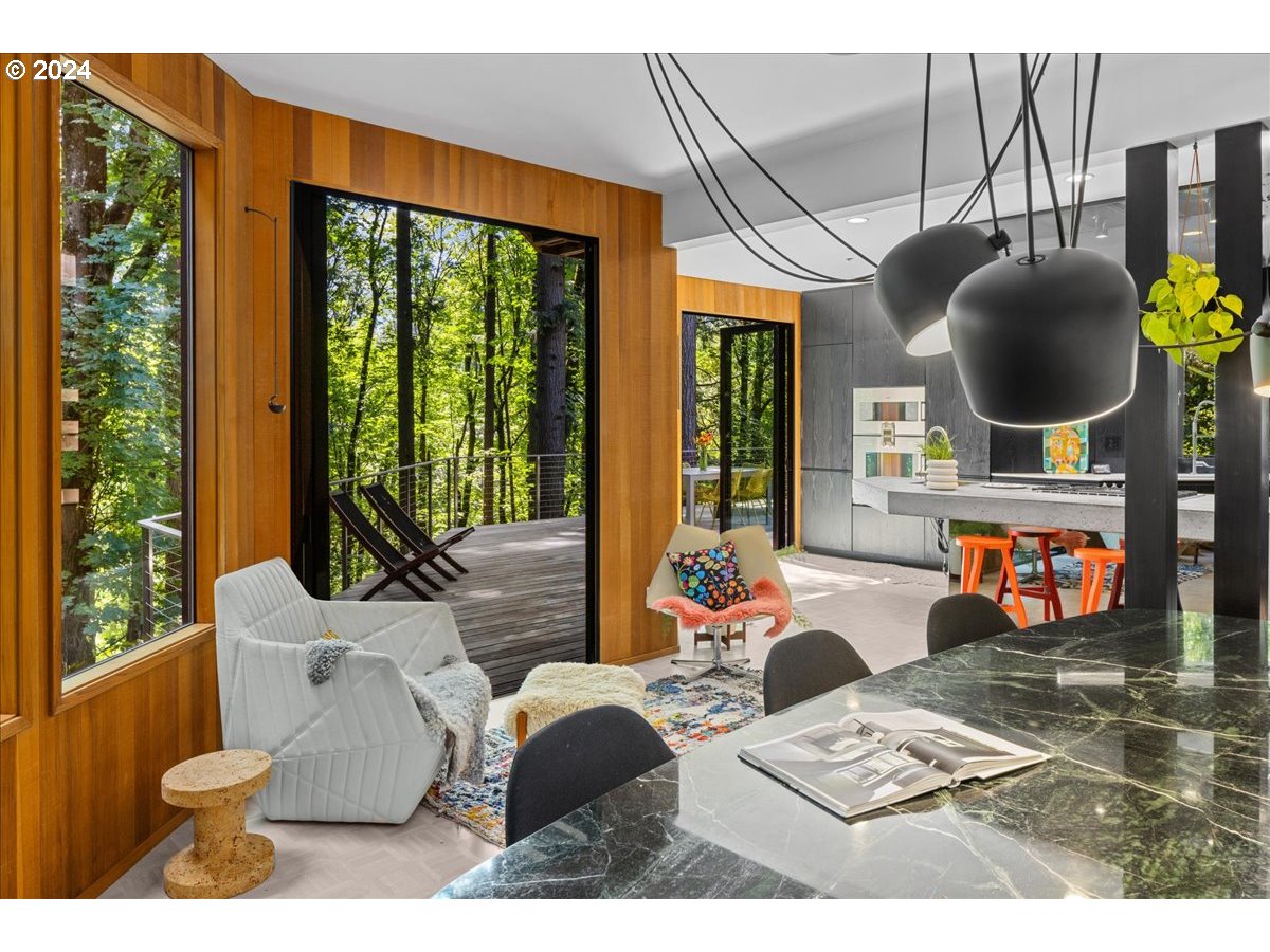 3204 Southwest Upper Cascade Drive Portland, OR 97205 - Photo 8 of 40 a outdoor living space with furniture potted plant and a large window