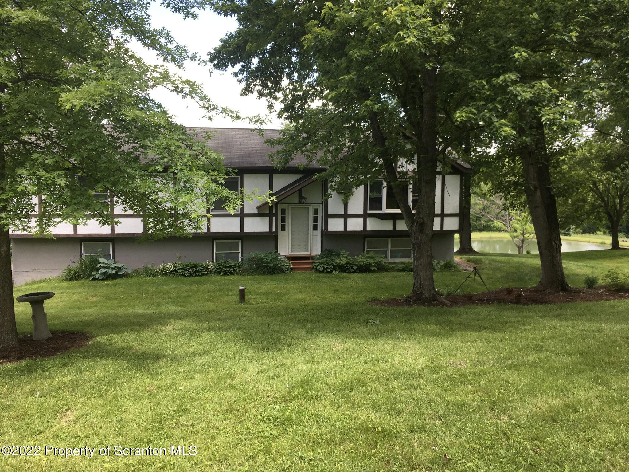 487 Baptist Hill Road Hallstead, PA 18822 - Photo 1 of 53 a view of a house with a backyard