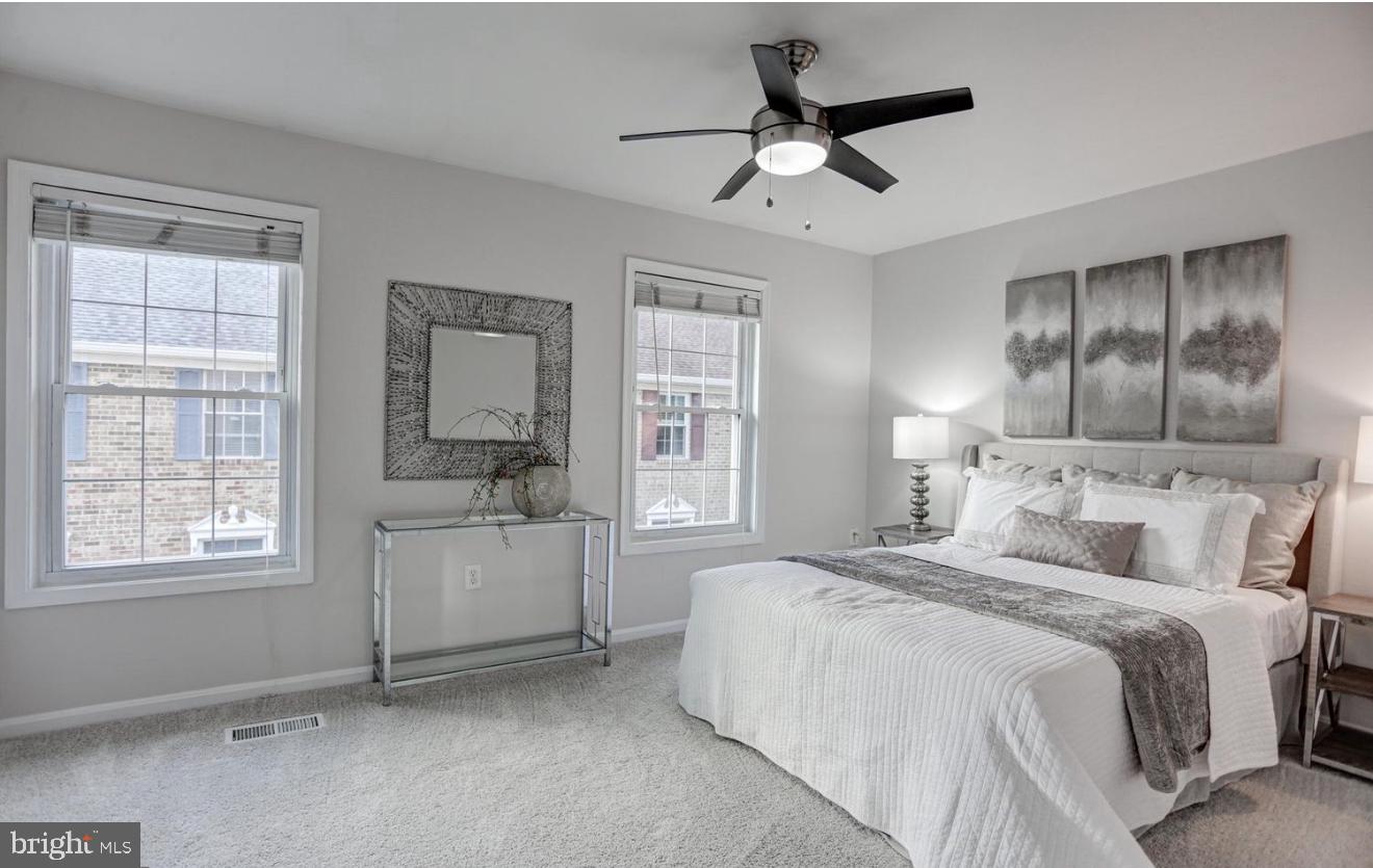 927 South Rolfe Street, Unit 2 Arlington, VA 22204 - Photo 12 of 17 a bedroom with a bed and a large window