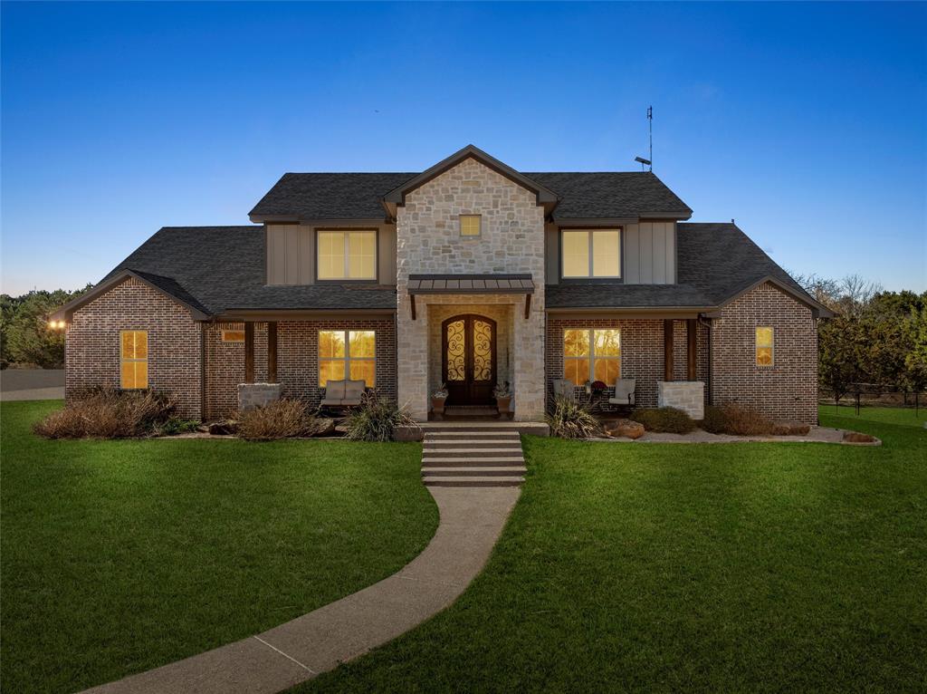 18503 Wortham Bend Road China Spring, TX 76633 - Photo 2 of 40 a front view of a house with a garden