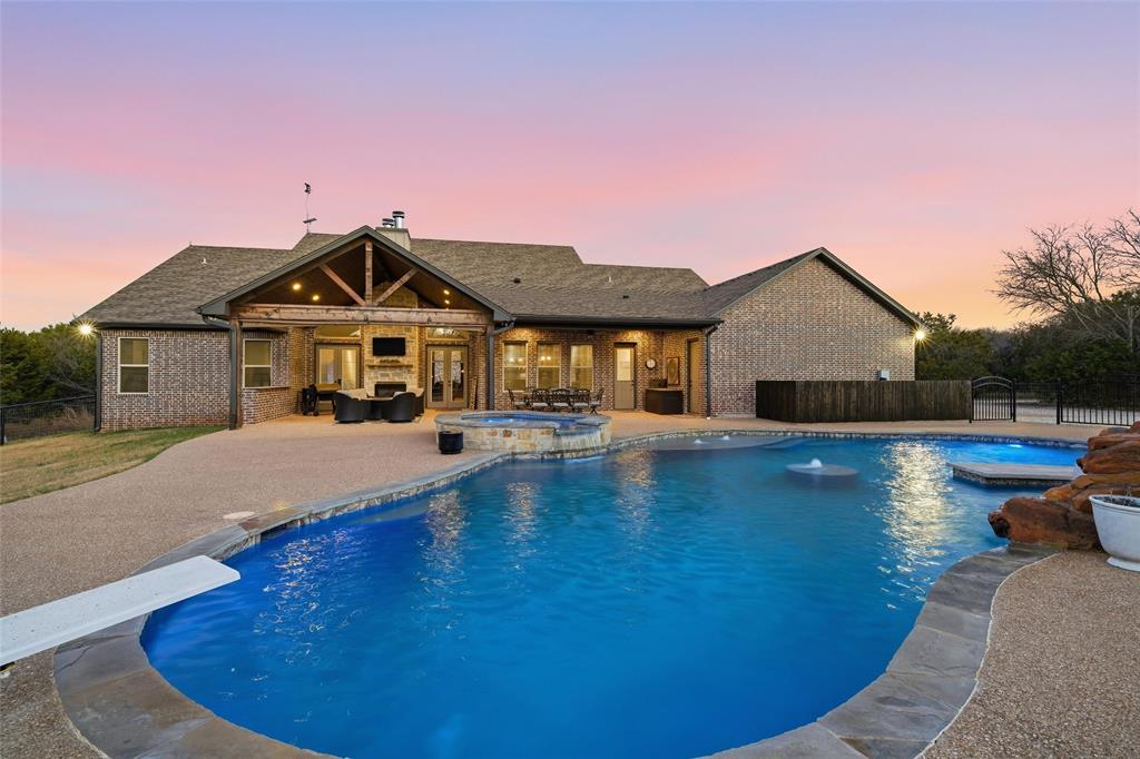 18503 Wortham Bend Road China Spring, TX 76633 - Photo 3 of 40 a front view of a house with swimming pool