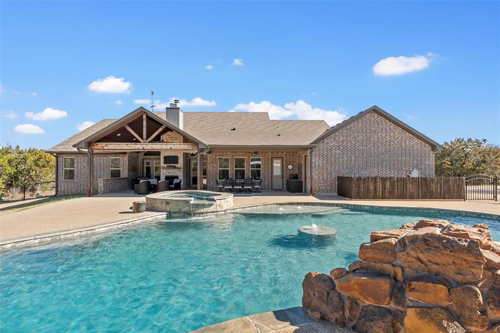 18503 Wortham Bend Road China Spring, TX 76633 - Photo 32 of 40 a front view of a house with swimming pool having outdoor seating