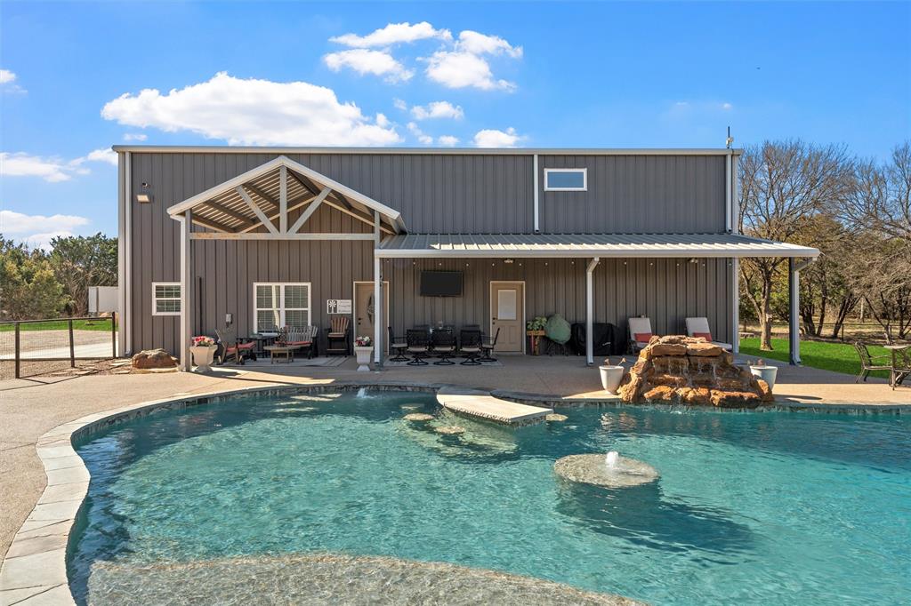 18503 Wortham Bend Road China Spring, TX 76633 - Photo 34 of 40 a front view of a house with a yard fire pit and outdoor seating