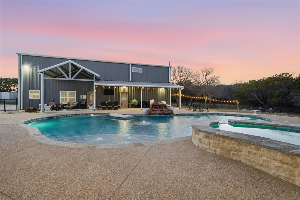 18503 Wortham Bend Road China Spring, TX 76633 - Photo 4 of 40 a front view of a house with garden