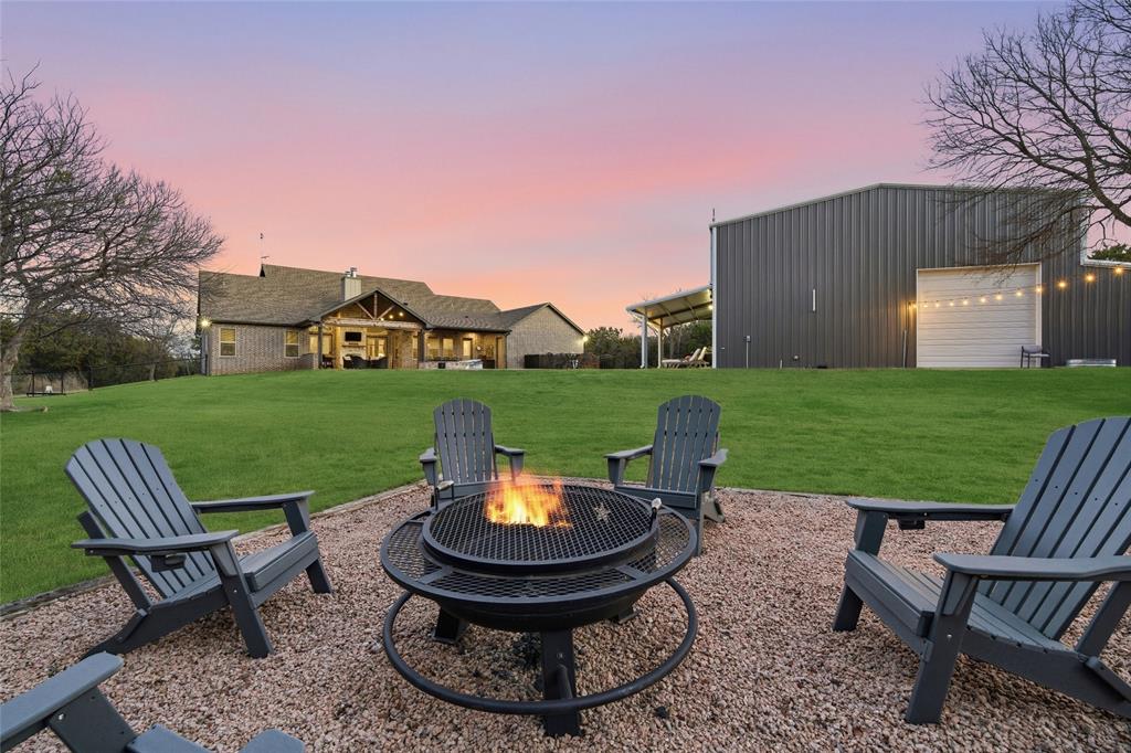 18503 Wortham Bend Road China Spring, TX 76633 - Photo 6 of 40 a view of a table and chairs in backyard of the house