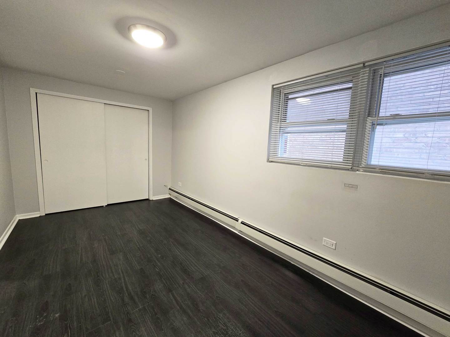 5972 South Archer Avenue, Unit GN Chicago, IL 60638 - Photo 12 of 16 an empty room with a window