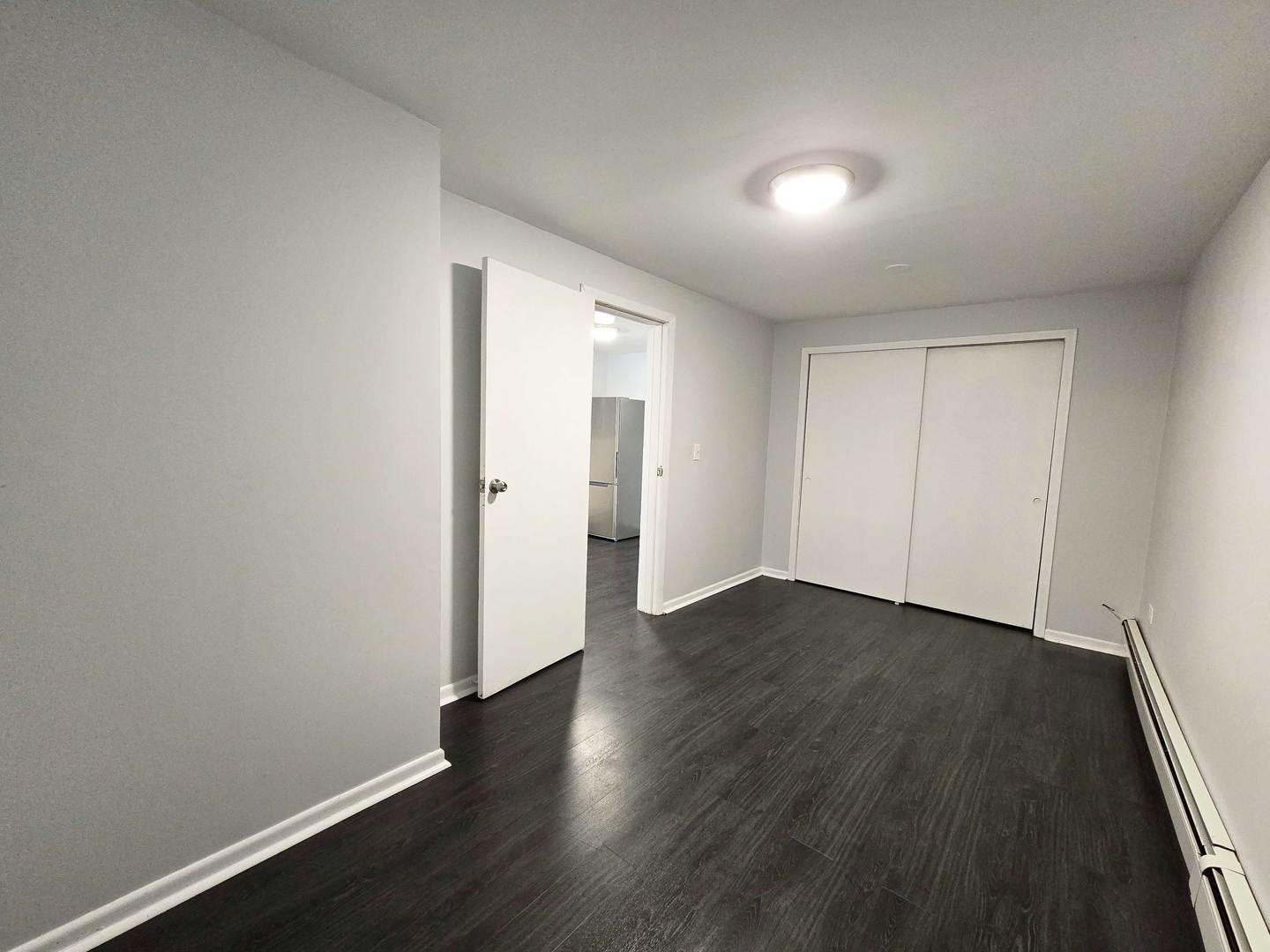 5972 South Archer Avenue, Unit GN Chicago, IL 60638 - Photo 13 of 16 a view of an empty room with wooden floor