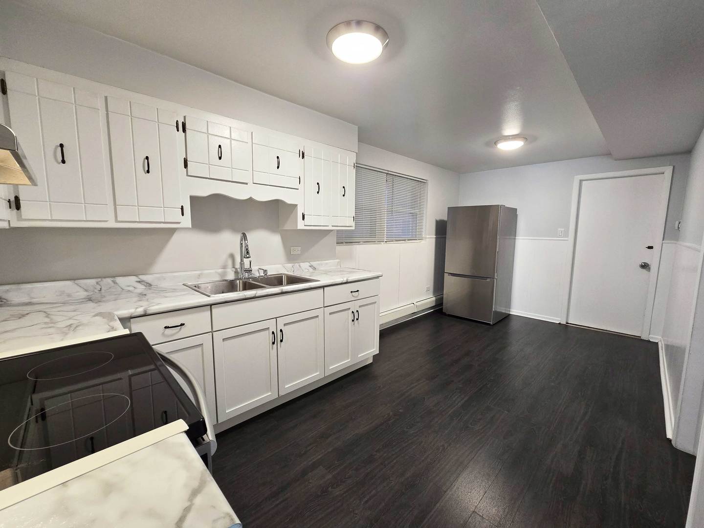 5972 South Archer Avenue, Unit GN Chicago, IL 60638 - Photo 6 of 16 a kitchen with a refrigerator sink and cabinets