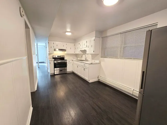 a bathroom with a glass shower door