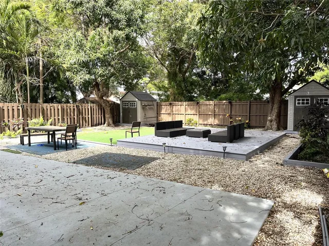 a bedroom with a bed and a mirror