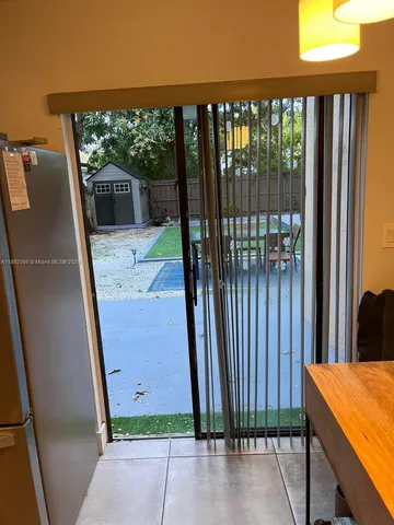 a view of backyard with seating and green space