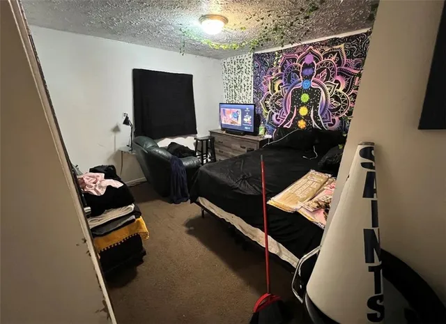 a living room with furniture and flat screen tv