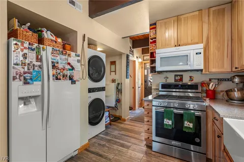 a kitchen with stainless steel appliances granite countertop a stove and a cabinets