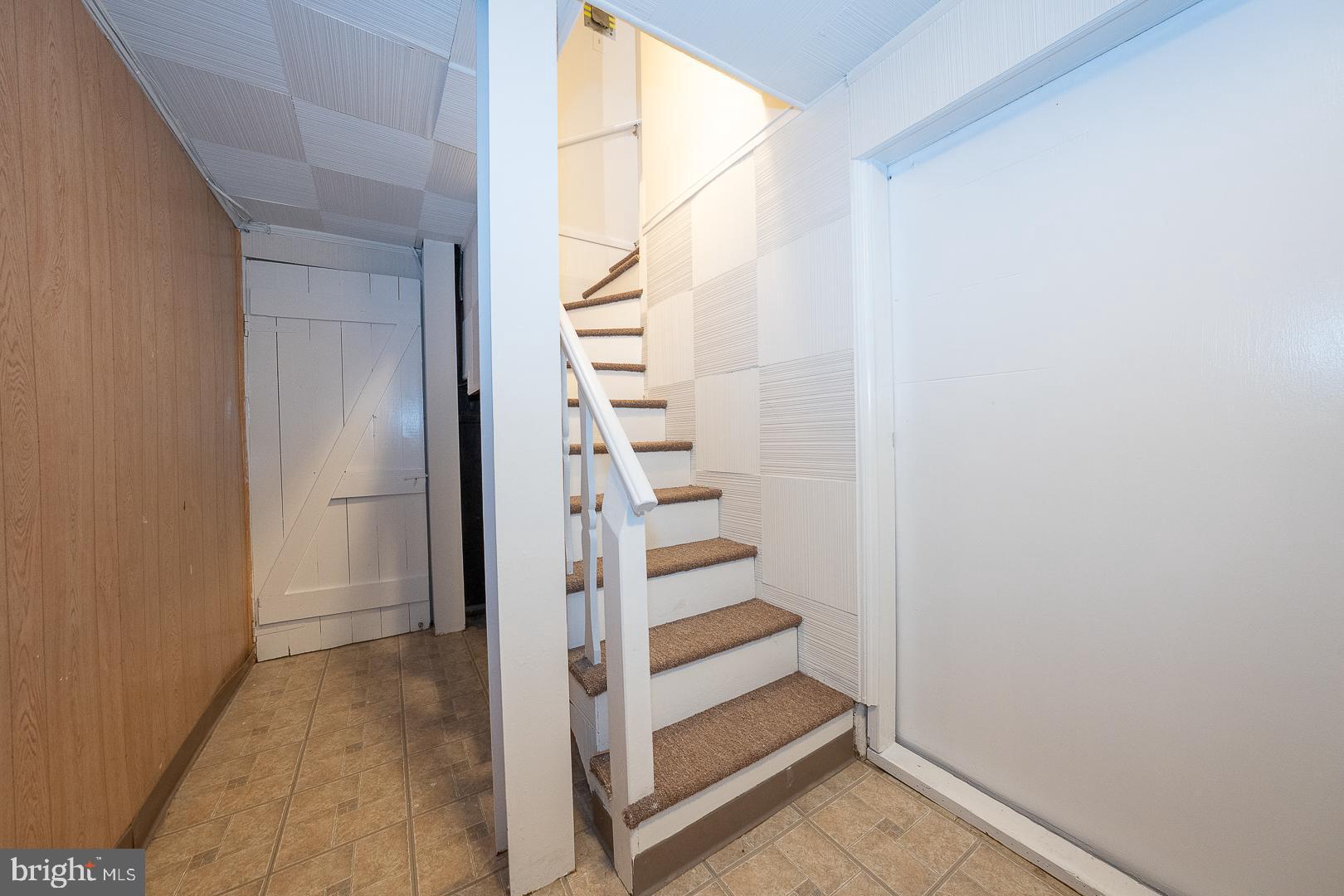 911 Darby Road Havertown, PA 19083 - Photo 42 of 54 a view of entryway with wooden floor and stairs