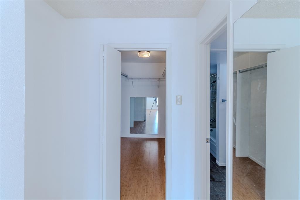 4859 Cedar Springs Road, Unit 234 Dallas, TX 75219 - Photo 11 of 22 a view of a hallway with wooden floor