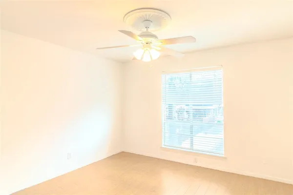 a view of walk in closet with wooden floor