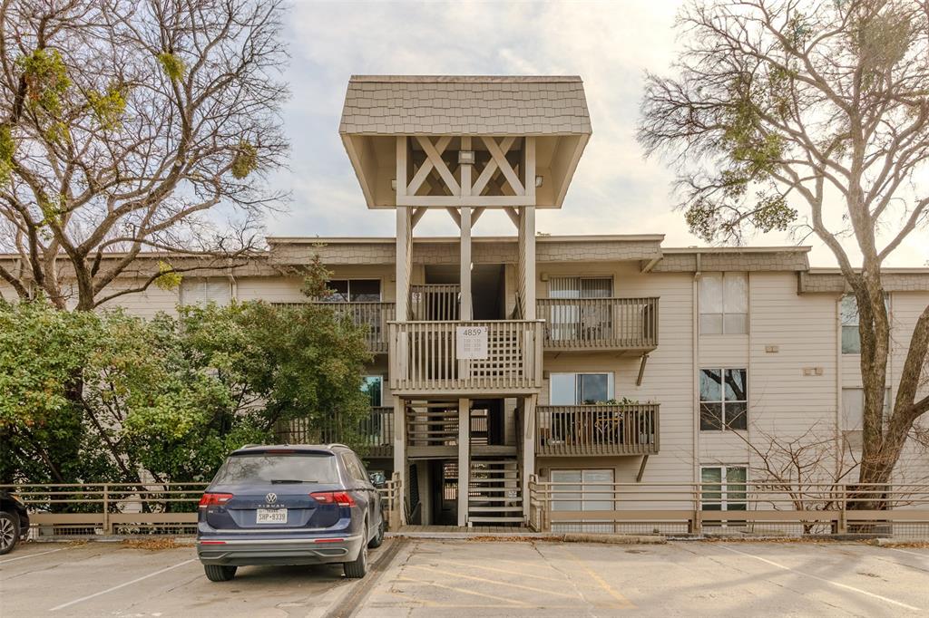 4859 Cedar Springs Road, Unit 234 Dallas, TX 75219 - Photo 2 of 30 a car parked in front of a building