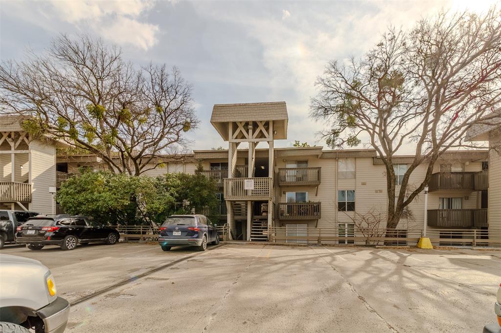 4859 Cedar Springs Road, Unit 234 Dallas, TX 75219 - Photo 2 of 22 a car parked in front of a building