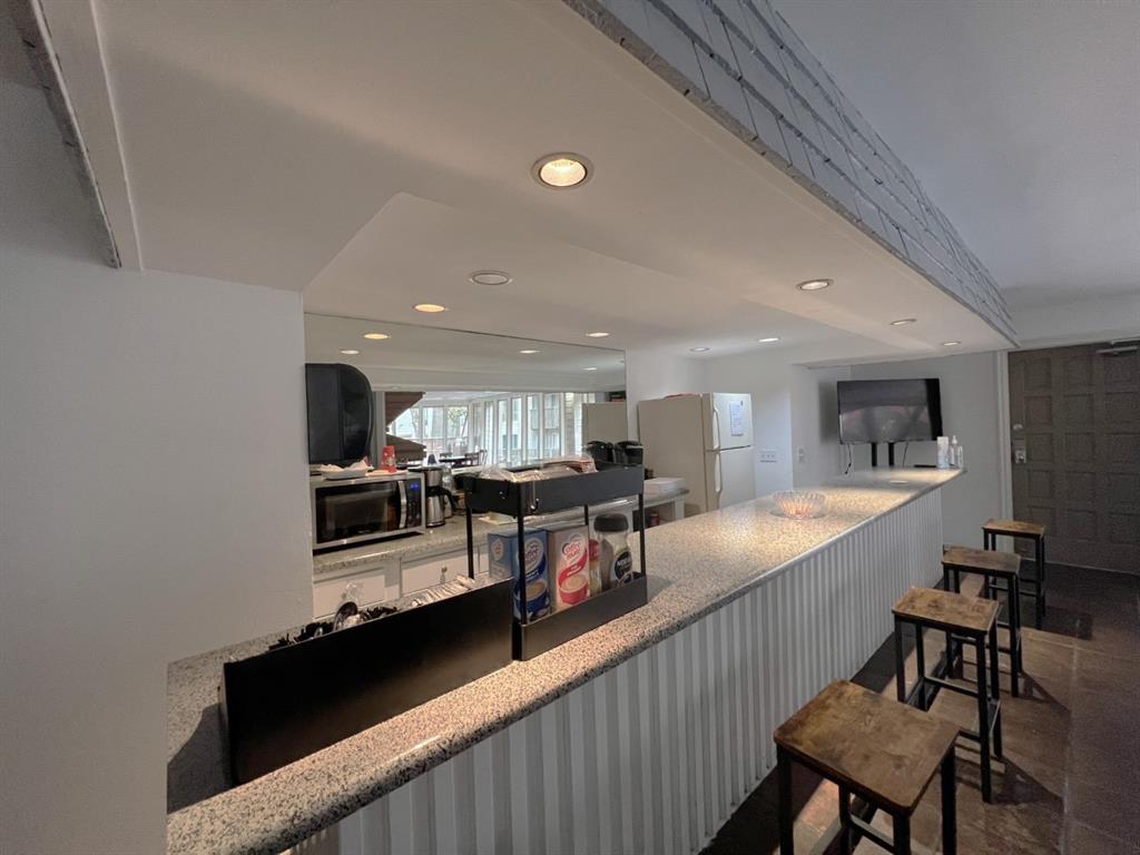 4859 Cedar Springs Road, Unit 234 Dallas, TX 75219 - Photo 21 of 22 a view of a kitchen and dining room