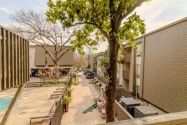 a view of a house with swimming pool and a yard