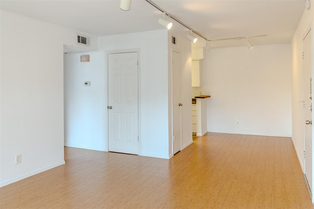 4859 Cedar Springs Road, Unit 234 Dallas, TX 75219 - Photo 10 of 30 a view of a big room with closet and chandelier fan