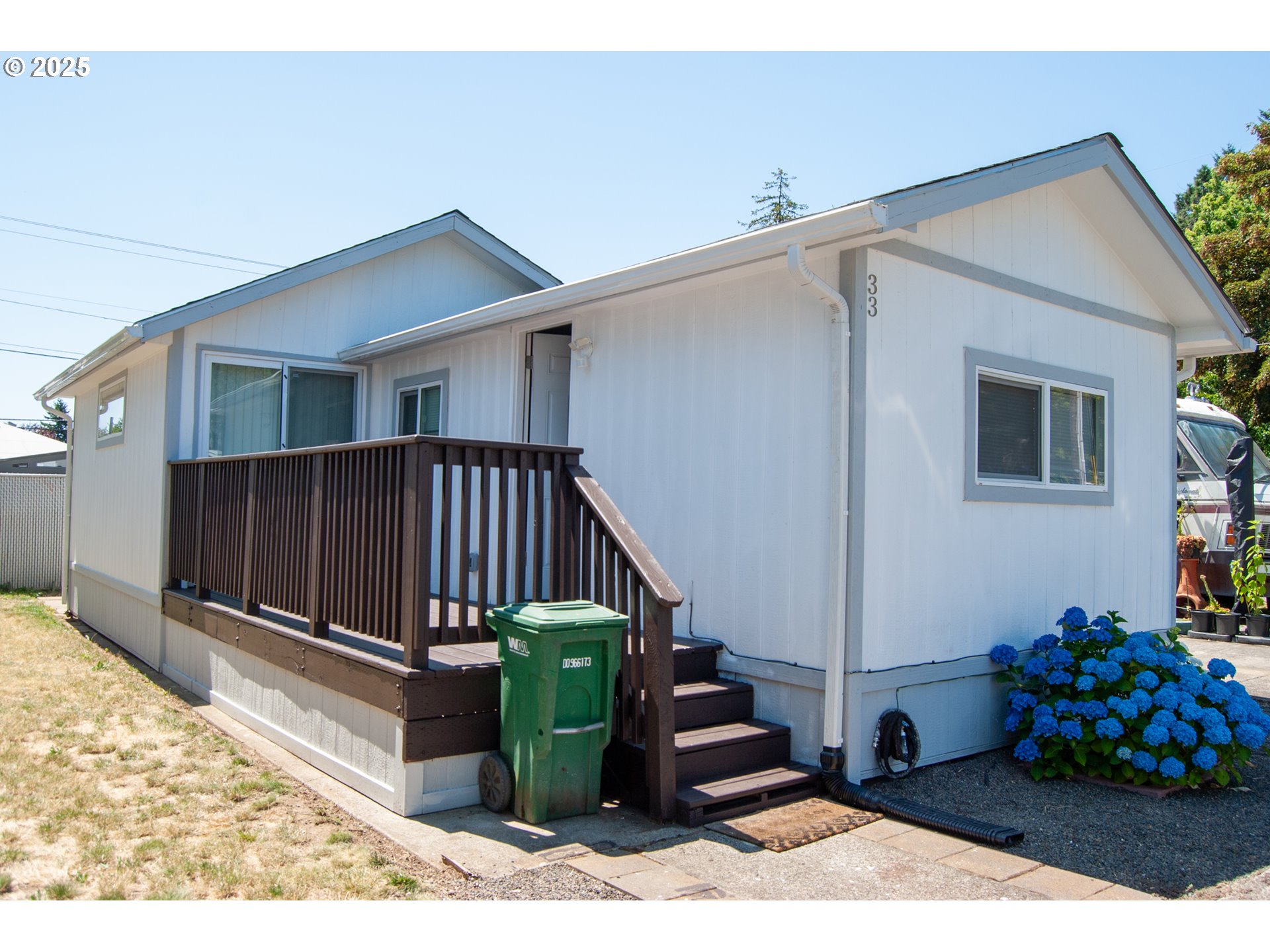 10901 Southeast Powell Boulevard, Unit 33 Portland, OR 97266 - Photo 1 of 12 a view of a house with wooden floor