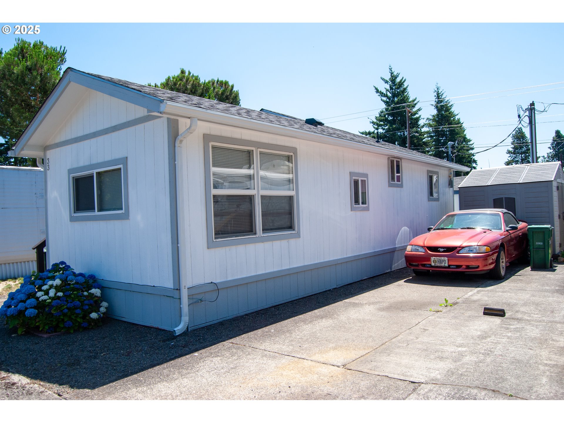 10901 Southeast Powell Boulevard, Unit 33 Portland, OR 97266 - Photo 3 of 12 a front view of a house with a garden