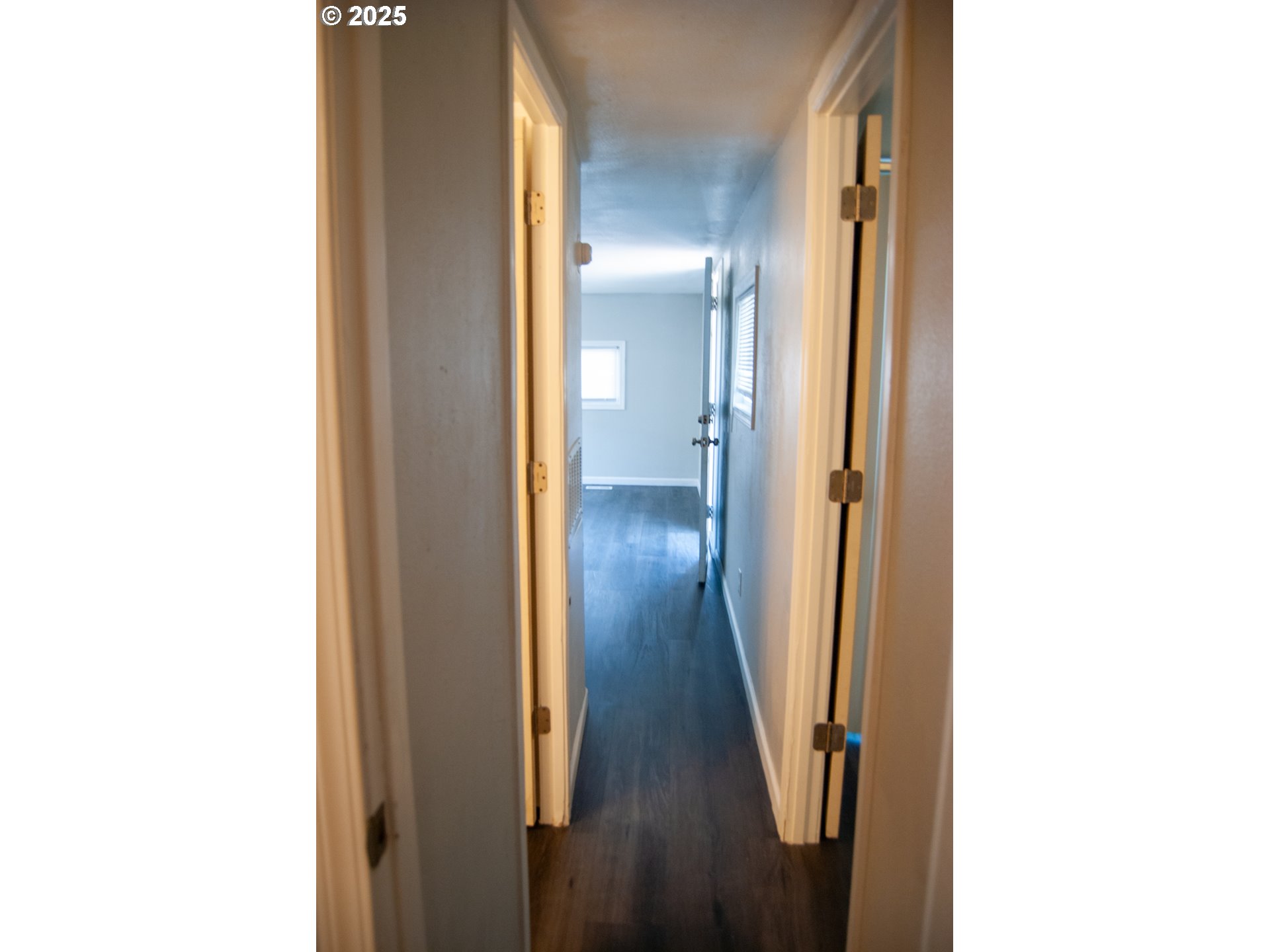 10901 Southeast Powell Boulevard, Unit 33 Portland, OR 97266 - Photo 7 of 12 a view of a hallway with wooden floor