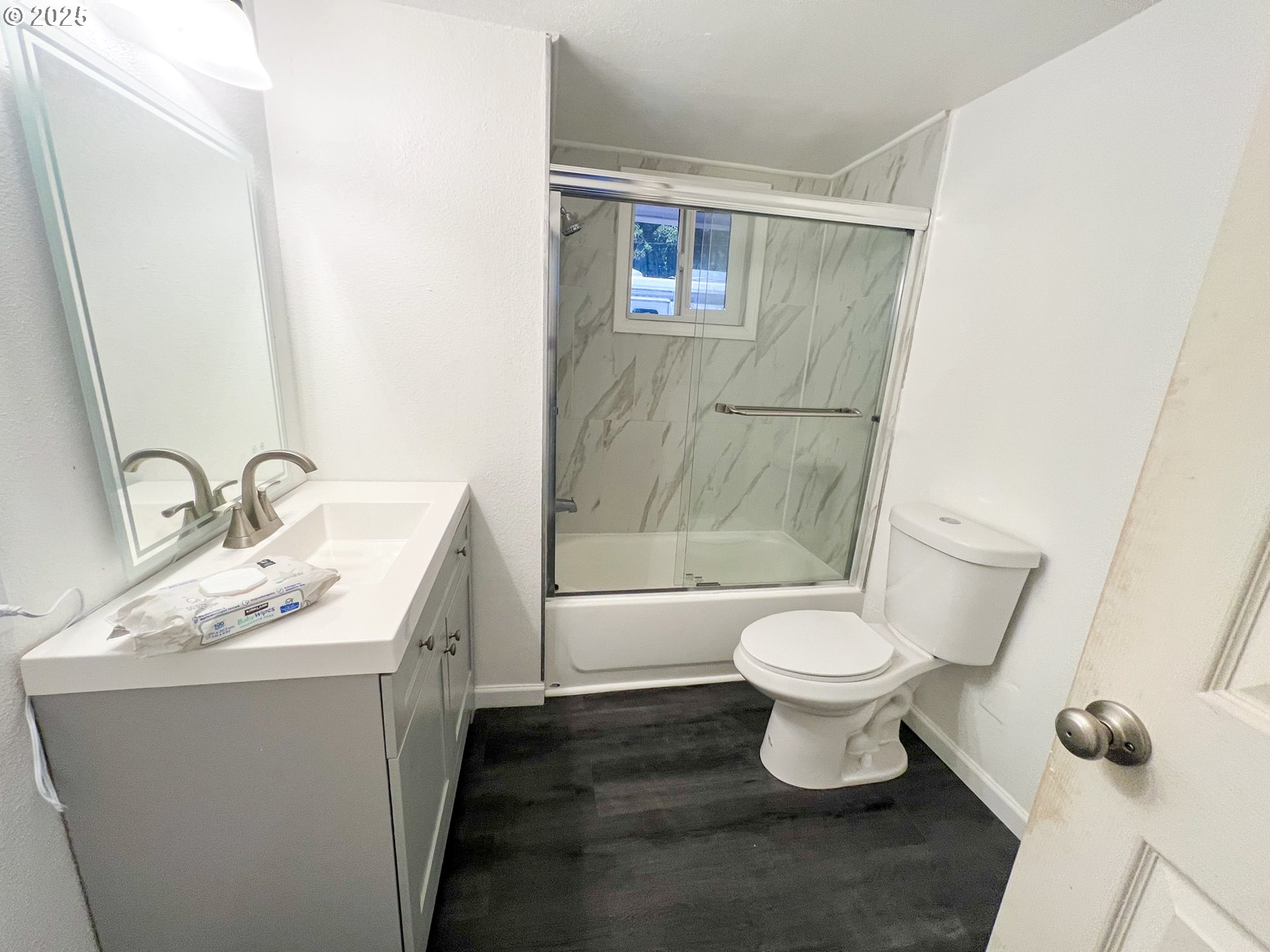 10901 Southeast Powell Boulevard, Unit 33 Portland, OR 97266 - Photo 8 of 12 a bathroom with a sink toilet and shower