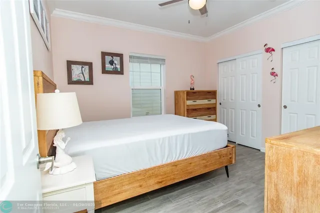 a bedroom with a bed and a lamp on table