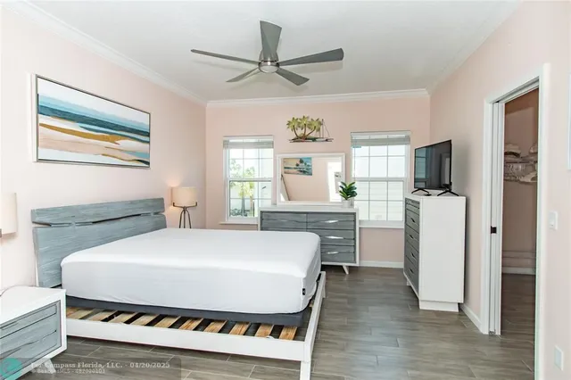 a large white bed in a white room