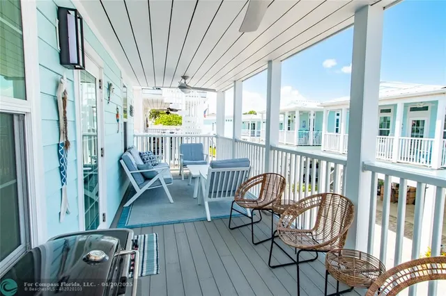 a view of a balcony with furniture