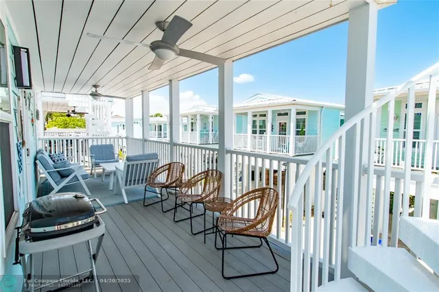 a view of a balcony with chairs