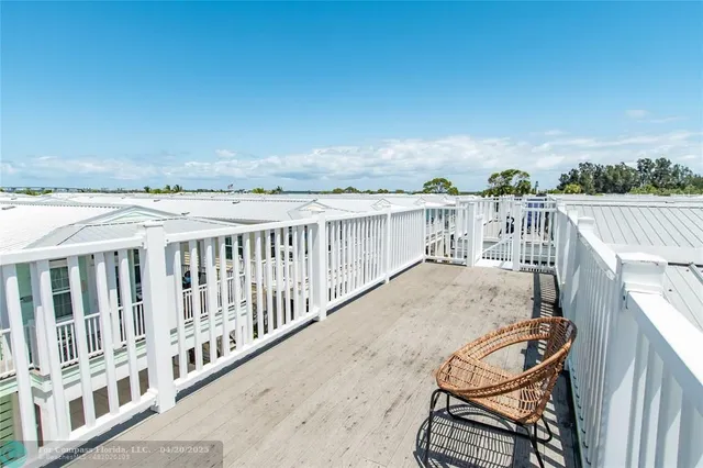 a view of a balcony with chairs