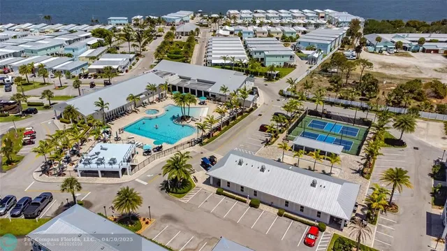 a view of a house with potted plants
