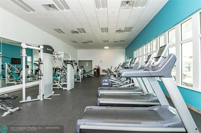 a view of a livingroom with furniture and a flat screen tv