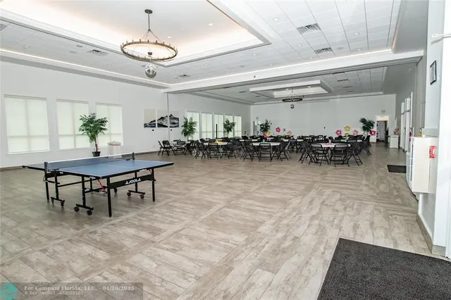 a view of a room with lots of wooden furniture and a mirror